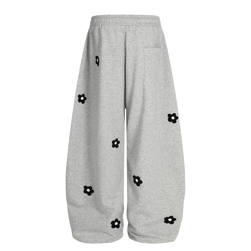 Flower embroidery curved knife sweatpants for men and women