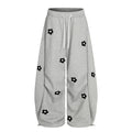 Flower embroidery curved knife sweatpants for men and women