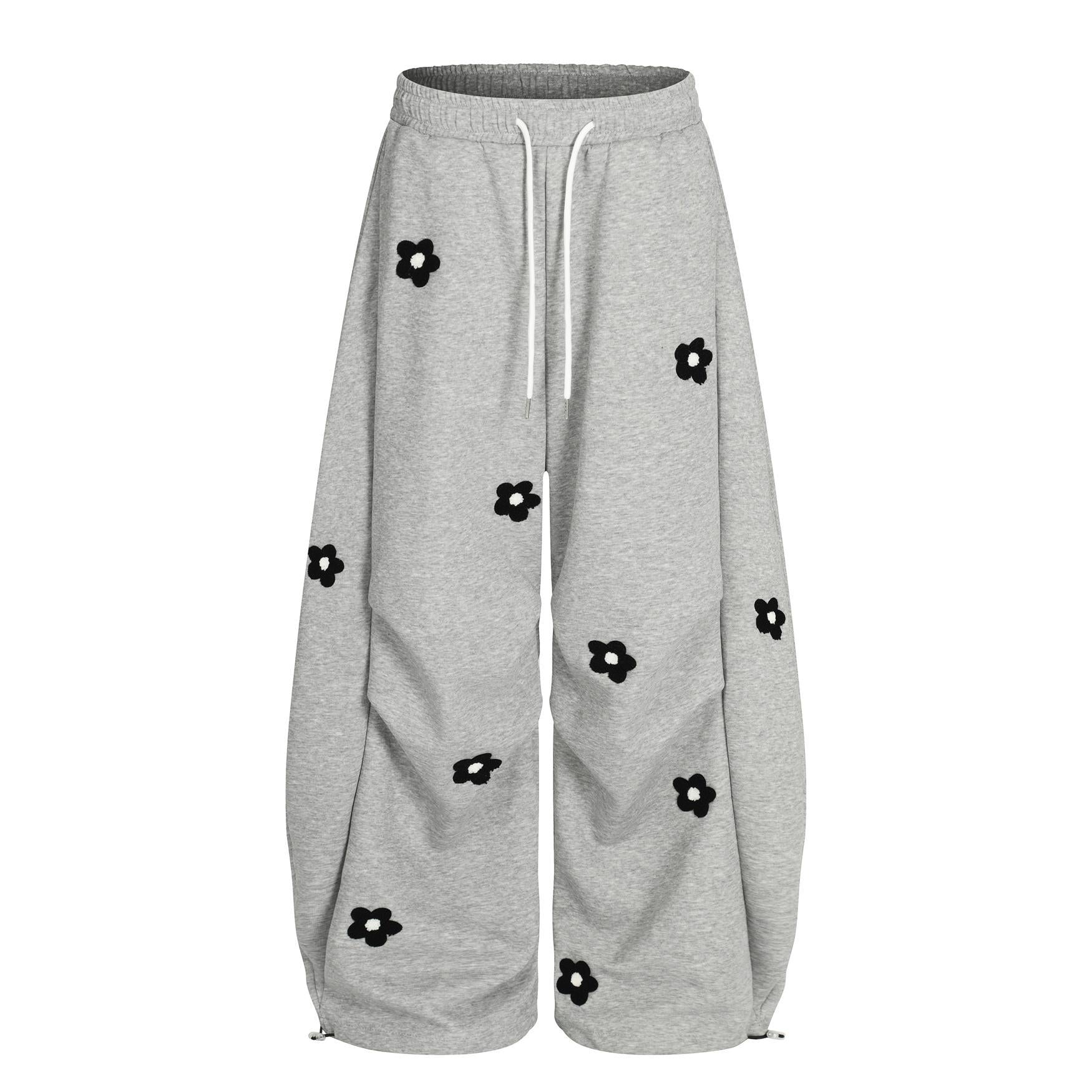Flower embroidery curved knife sweatpants for men and women