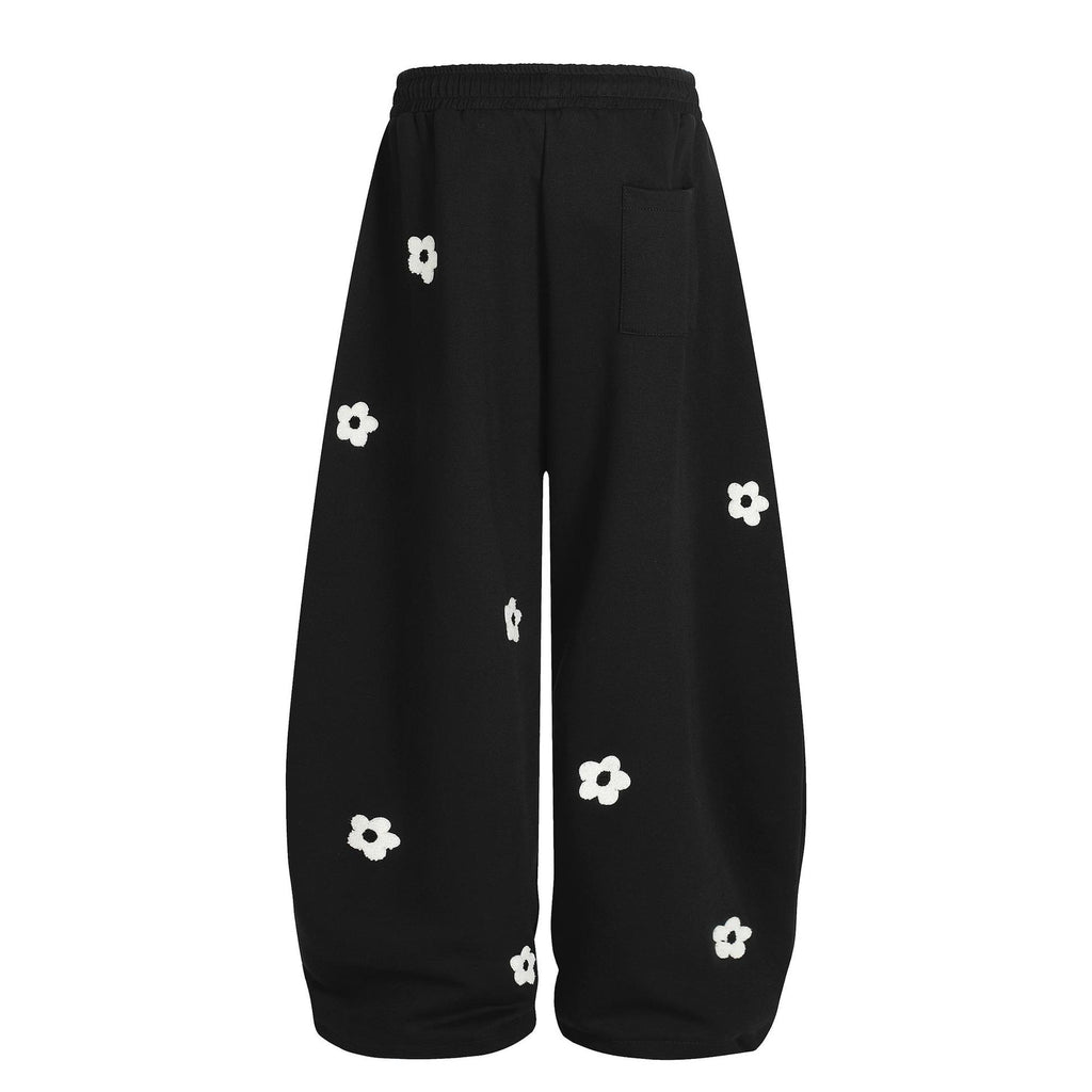 Flower embroidery curved knife sweatpants for men and women
